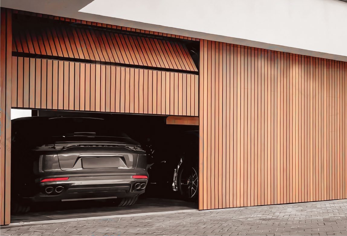 Warm wood-tone grille garage door partially raised over a parked car