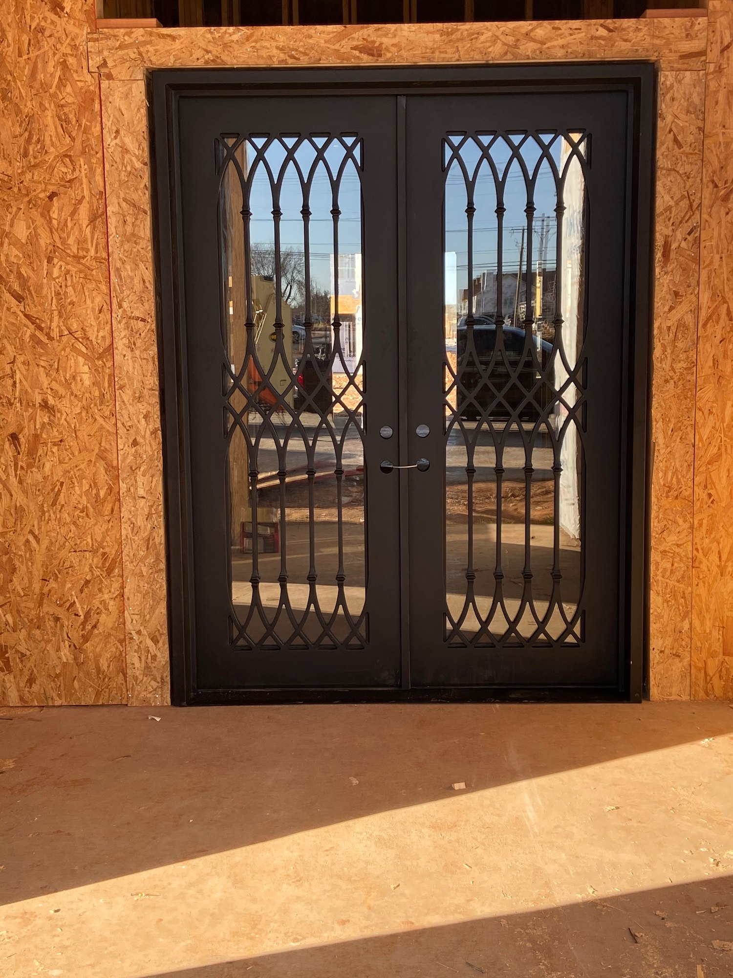 Decorative double entry in a stucco opening
