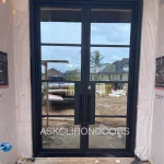 iron door with clear glass windows